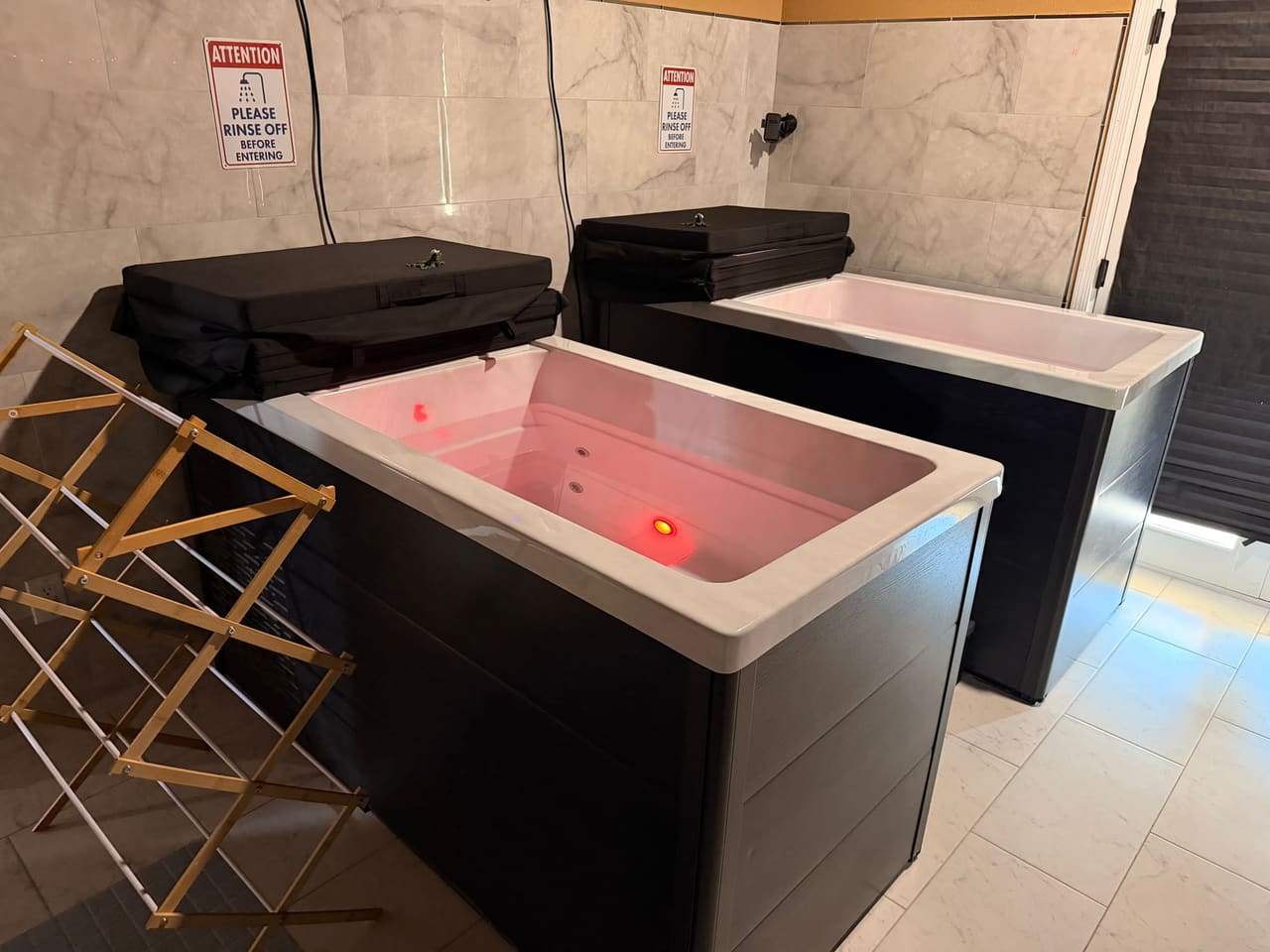 Person relaxing under red light therapy